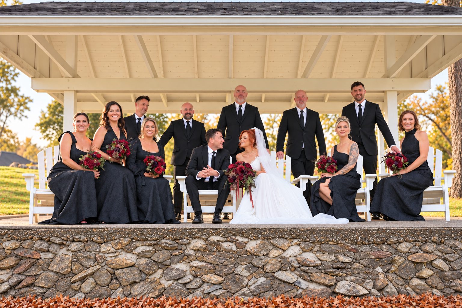 Full wedding party portrait on a stone wall